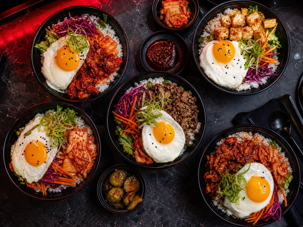 Seoul Street Kitchen cook plating a rice bowl